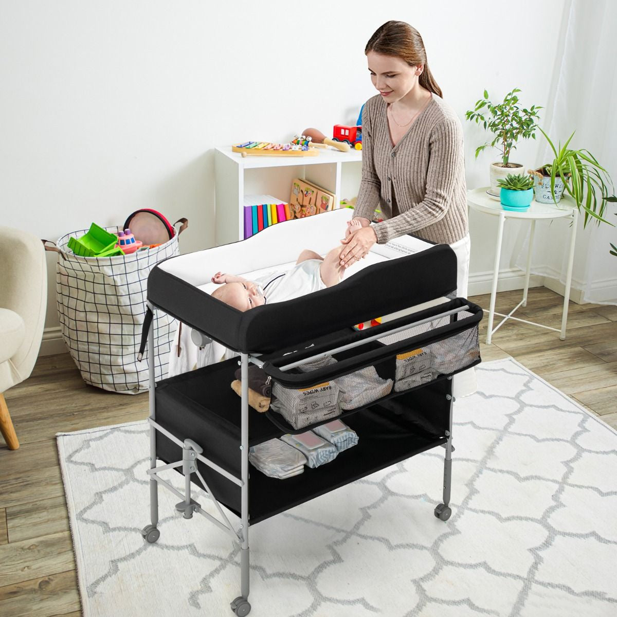 Folding Nursery Changing Table with Lockable Wheels and Storage Basket