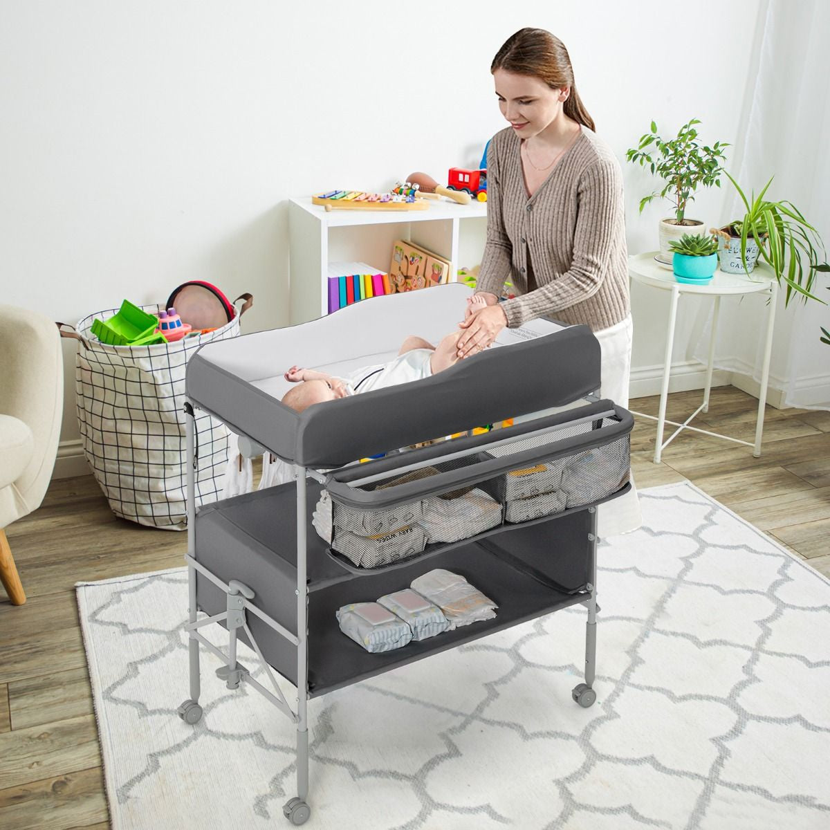 Folding Nursery Changing Table with Lockable Wheels and Storage Basket